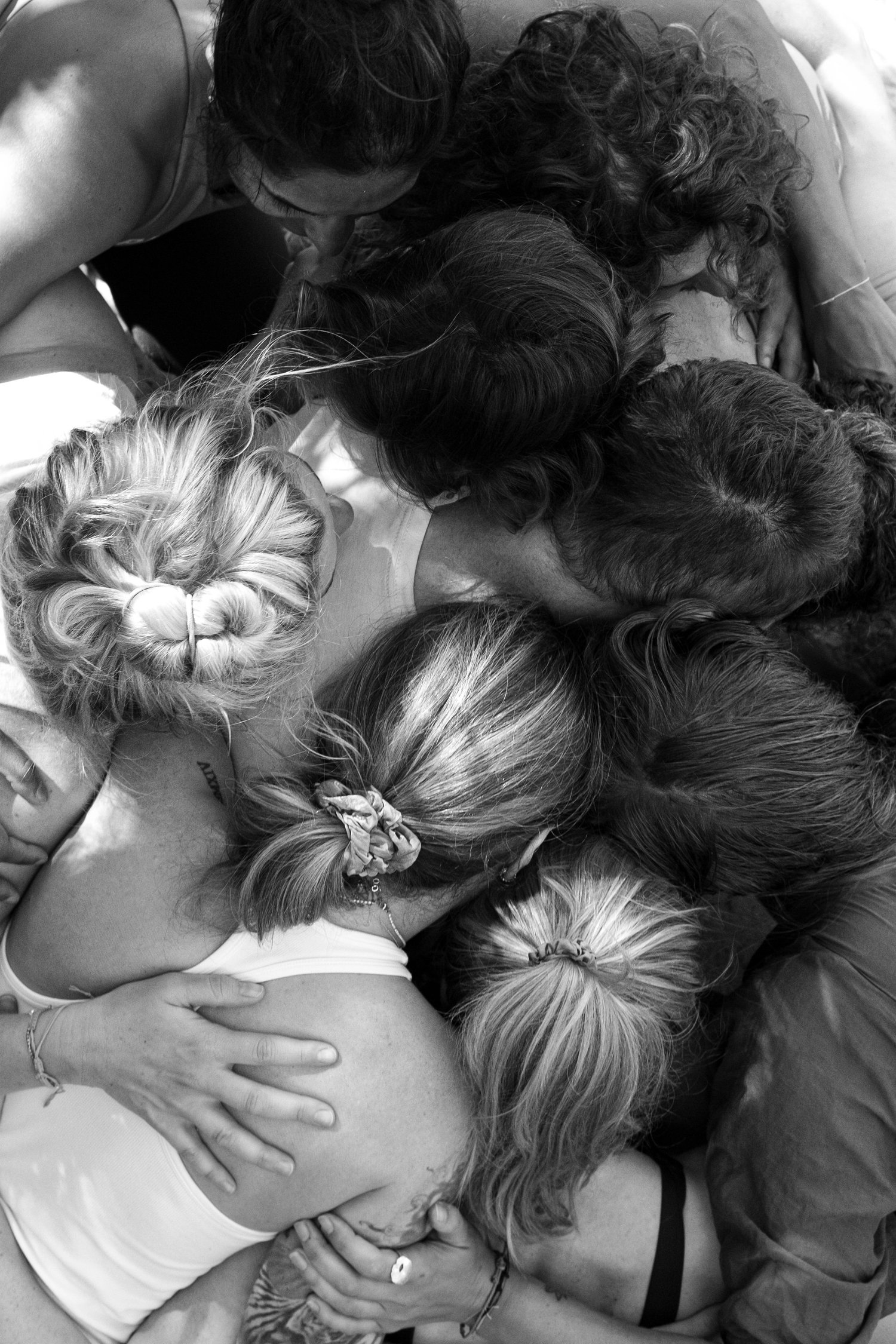 A group of RYMERS in a close huddle, seen from above